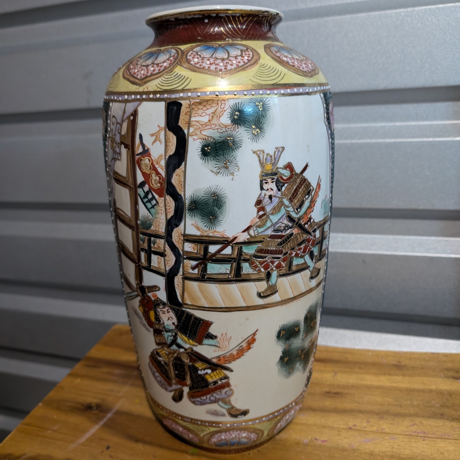 Vintage Japanese Satsuma vase ornate with samurai scene and flowers